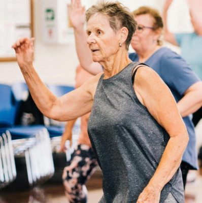 Elderly Woman in an Exercise Class